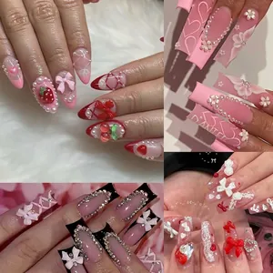 24-grid set of French style press-on nails featuring 3D bows, pearls, and rhinestones