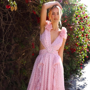 Pink floral maxi dress with V-neck, ruffle shoulders, and waist cut-outs for vacation