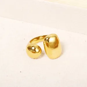 Polished gold stainless steel open ring featuring a unique irregular spherical design