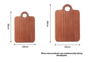 Macro view of ebony wood cutting boards showing dual sizes and natural wood grain