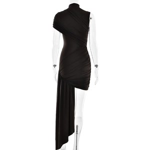 Detail of black ruched asymmetrical dress with elegant side drape and ruffled texture