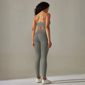 Detail of sage green seamless high waist yoga leggings with contouring lines