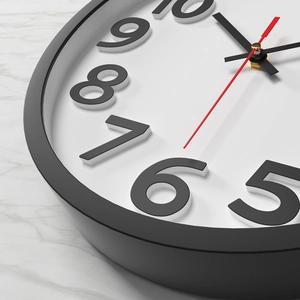 Modern 12-inch wall clock with black 3D numerals and red second hand on marble background