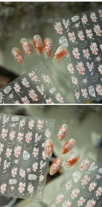 Detail of 3D embossed floral nail stickers TL-427 with red gradients and pearl accents