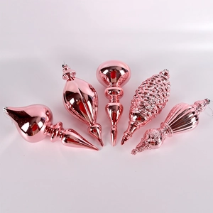 Rose gold festive Christmas tree ornaments set with metallic finish in unique shapes