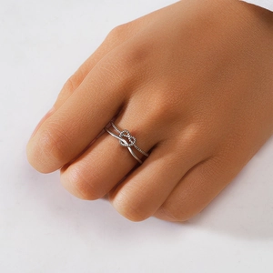 Close-up of S925 sterling silver double-layer ring with knot detail on model finger