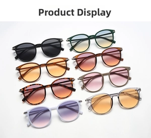 Flat lay of oversized round sunglasses in 8 assorted colors with metallic temple accents