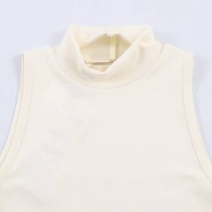 Detail of the high neckline and knit texture on this cream white sleeveless top