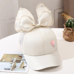 Detail of kids breathable mesh baseball cap with mesh bow, pearls and lollipop charm