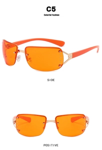 Macro view of Y2K rimless sunglasses with orange lenses and golden rivet details