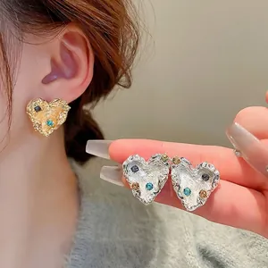 Lava texture heart earrings with colorful rhinestones in gold and silver finish