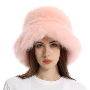 Close-up of fluffy pink faux fox fur texture on a warm winter bucket hat for women