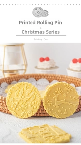 Detail of Christmas embossed rolling pin with reindeer and snowflake patterns for cookies