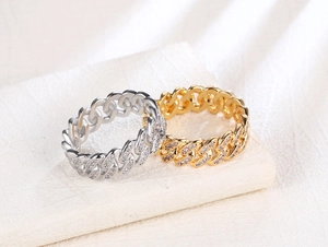 Detail of 8mm gold and silver Cuban link rings with micro-pave cubic zirconia