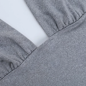 Close-up of the grey knit fabric detail and stitching on the halter neck square top
