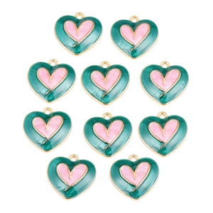 Macro shot of 10 green and pink enamel heart pendants with gold-plated edges
