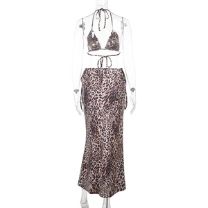 Detail view of the lace-up back design on a brown leopard print bikini and skirt set