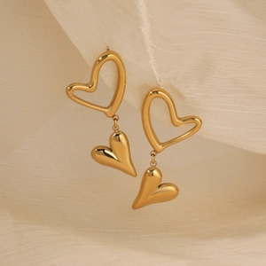 Elegant gold double heart drop earrings with polished metallic finish for women