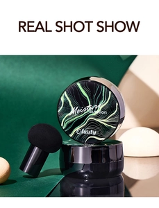 Detailed view of mushroom head sponge and moisture cushion foundation in sleek black case