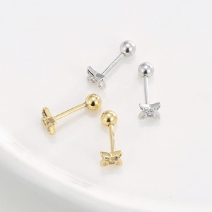 S925 silver star stud earrings with zircon inlay in gold and silver on ceramic tray