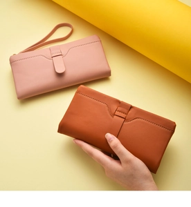 Women long wallet clutch PU leather bi-fold card holder purse with wrist strap detail view.