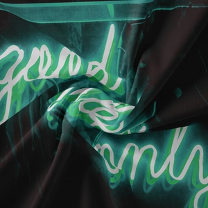 Detail shot of Good Vibes Only neon print on black bohemian tapestry fabric texture