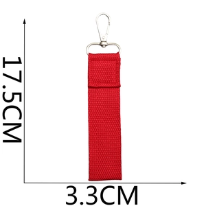 Detailed view of red woven ribbon keychain with dimensions 17.5cm by 3.3cm on white backdrop