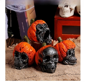 Macro detail of resin Halloween skull pumpkin figurines with distressed textures