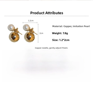 Detail view of 7.8g pearl and gold ball earrings measuring 1.2cm by 2cm on silver pins