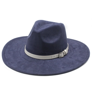 Detail of navy blue suede fedora featuring a wide brim and buckled leather hatband