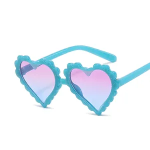 Kids heart shaped sunglasses with light blue glitter frames and gradient lenses