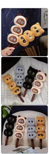 Detailed view of plush cat skewer toys in four colors with various cute facial expressions