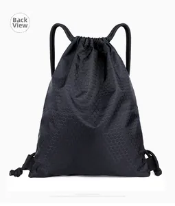 Close-up of black nylon drawstring bag showing reinforced corners and honeycomb texture