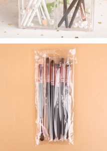 Close-up of 6pcs eye makeup brushes with black handles and rose gold ferrules in packaging
