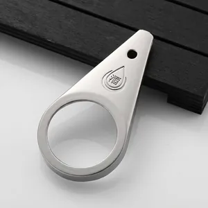 Macro view of teardrop stainless steel bottle opener with engraved wine character