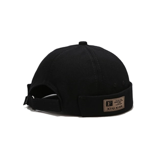 Retro black cotton Miki hat with adjustable back strap and vintage leather side patch