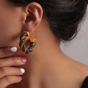 British vintage geometric C-shaped earrings with brown leather and gold metal twist design