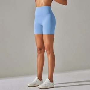 Detail of high-waist light blue yoga shorts showing seamless high-stretch fabric texture