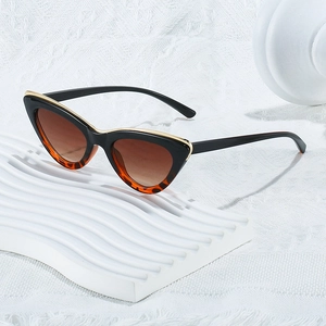 Cat eye sunglasses with tortoise frame, brown gradient lenses and gold metal trim detail