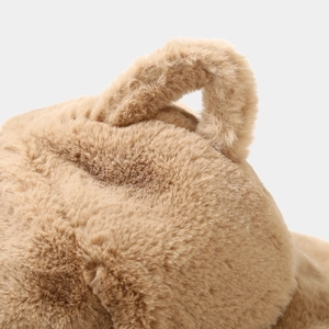 Detailed close-up showing the soft texture and fluffy long plush fabric of the brown hat