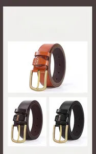 Detail of camel, coffee, and black faux leather belts with matte gold buckles
