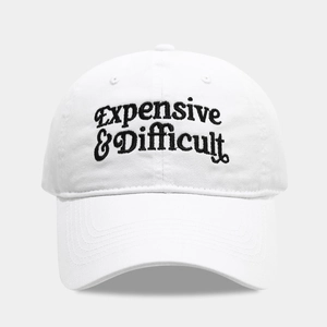 White cotton baseball cap with black Expensive & Difficult script embroidery on the front
