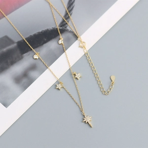 Detailed close-up of S925 sterling silver star pendant with delicate pave-set crystals