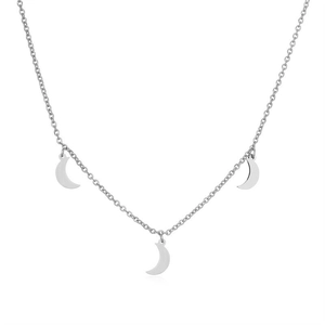 Close-up of silver chain necklace featuring three polished crescent moon pendants on white