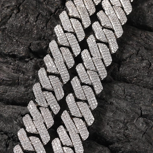 Macro shot of high-quality silver plated Cuban link chain with sparkling zircon inlay