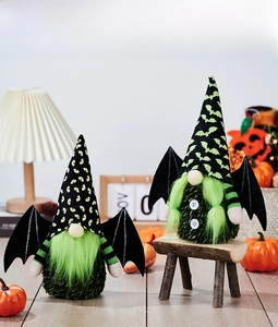 Detail of Halloween gnomes featuring green beards, bat wings, and striped knit arms