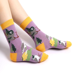 Purple and yellow crew socks featuring knitted owl and pine tree patterns for men and women