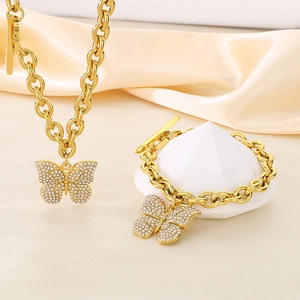 Goldenes Schmetterling Schmuckset mit Kristallquasten und OT-Verschluss auf Panzerkette