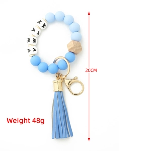 Blue MAMA silicone bead keychain bracelet with wooden bead and leather tassel, 20cm length