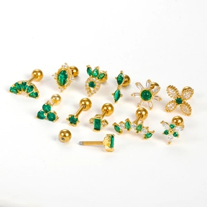 Set of 11 gold stainless steel cartilage studs with green zircon and flower designs